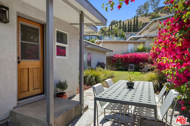a view of balcony with couch and outdoor seating