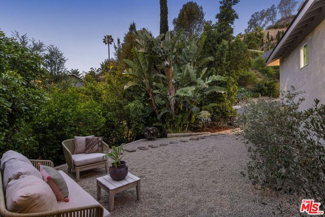 a view of a balcony with wooden floor and city view