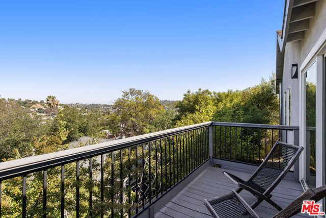 a view of a two chair in the balcony