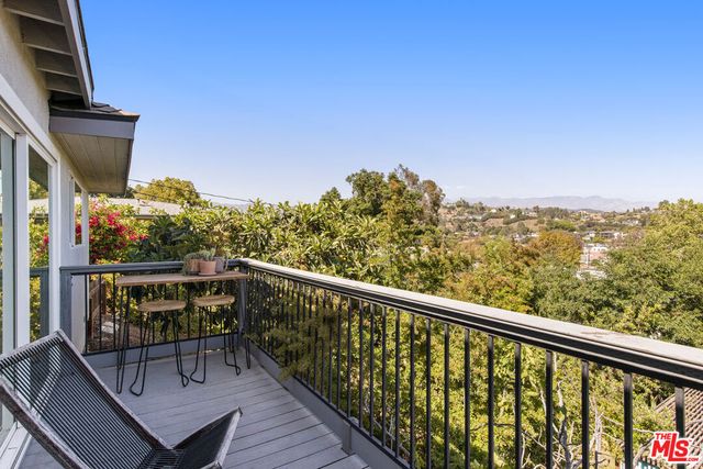 a view of balcony with furniture