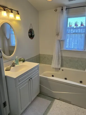 a bathroom with a sink and a bathtub