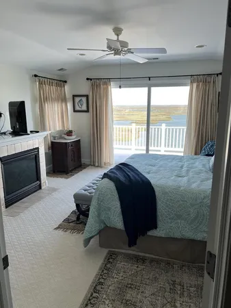 a spacious bedroom with a bed and a couch