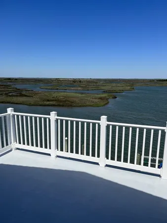 a view of a balcony with ocean view