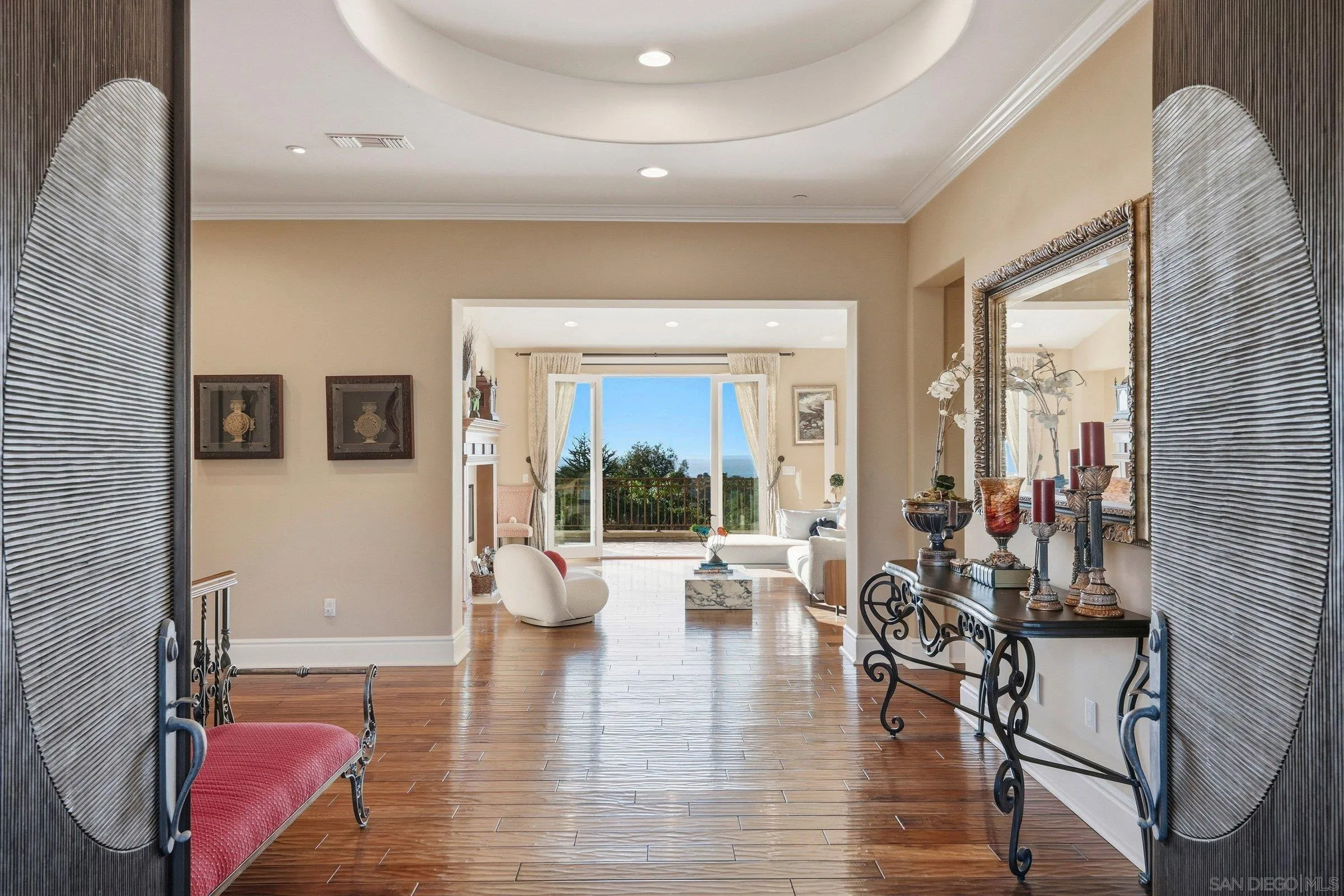 1690 Gascony Road Encinitas, CA 92024 - Photo 10 of 43 a living room with furniture large window and wooden floor