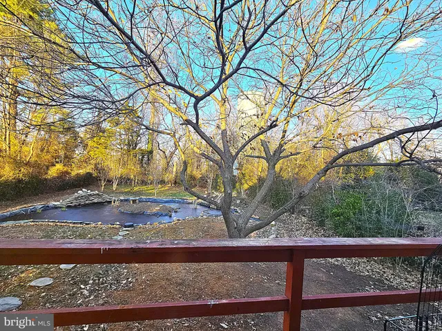 a bathroom with a granite countertop toilet sink and mirror