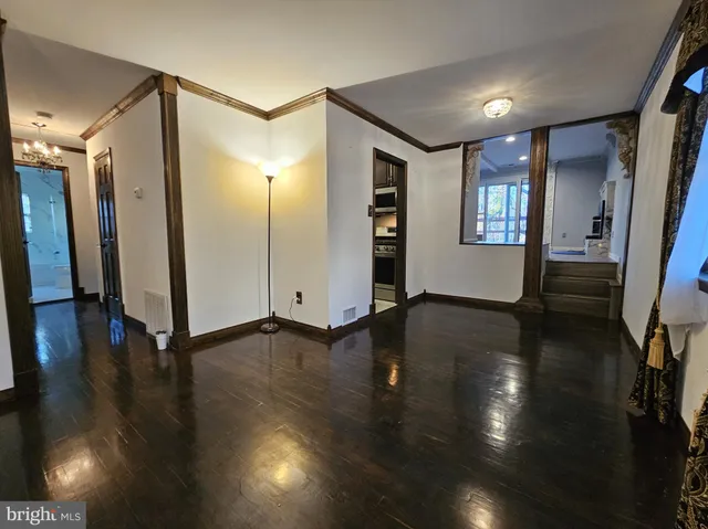 a kitchen with granite countertop stainless steel appliances and wooden cabinets