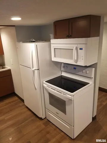 a kitchen with a stove and a microwave