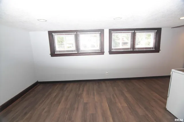 a kitchen with a sink stove and microwave