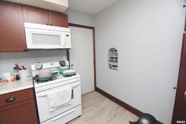 a bed room with a bed and a mirror