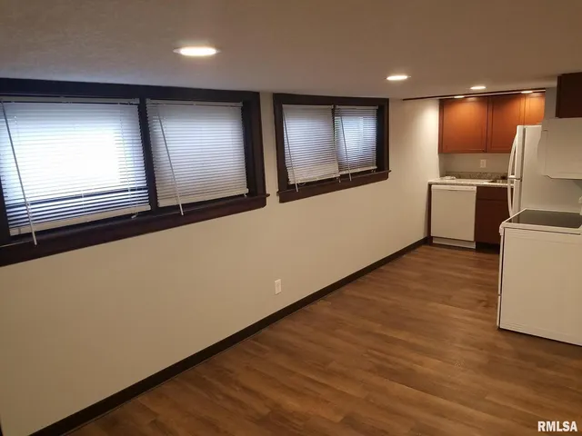 a kitchen with stainless steel appliances a refrigerator and a stove