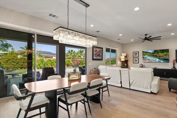 a view of a dining room with furniture window and outside view