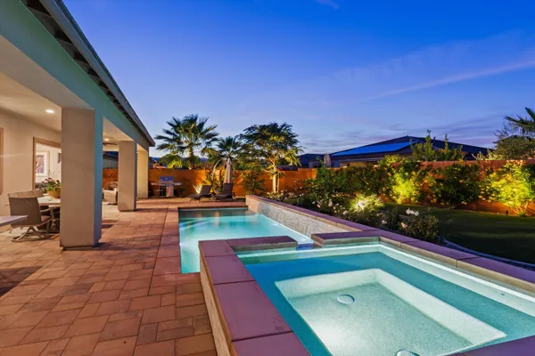 a room with pool table and a floor to ceiling window