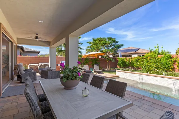 a view of a dining room with furniture window and outdoor view