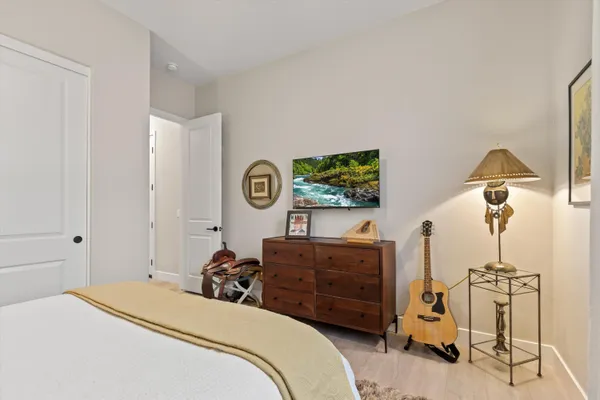 a bed room with a bed and a lamp