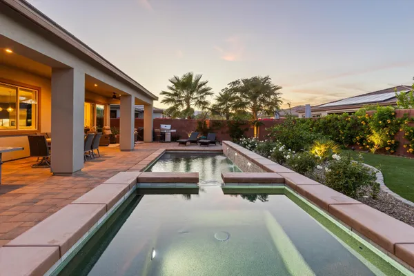 a view of swimming pool with lounge chair