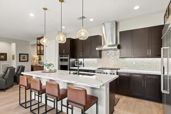 a kitchen with a sink stove and microwave