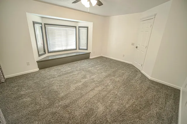 a view of a bedroom with wooden floor and bedroom
