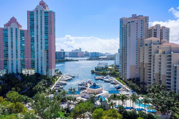 a view of a lake with tall buildings