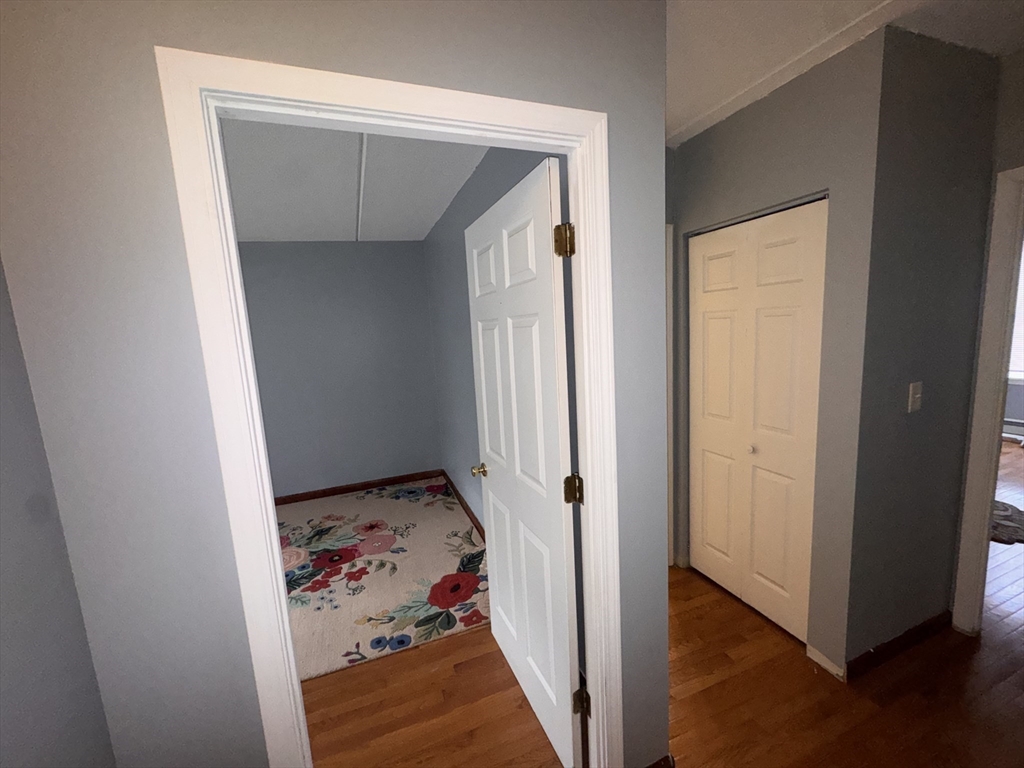 100 Lawn Street, Unit 100 Boston, MA 02120 - Photo 11 of 40 an entryway view with a wooden floor