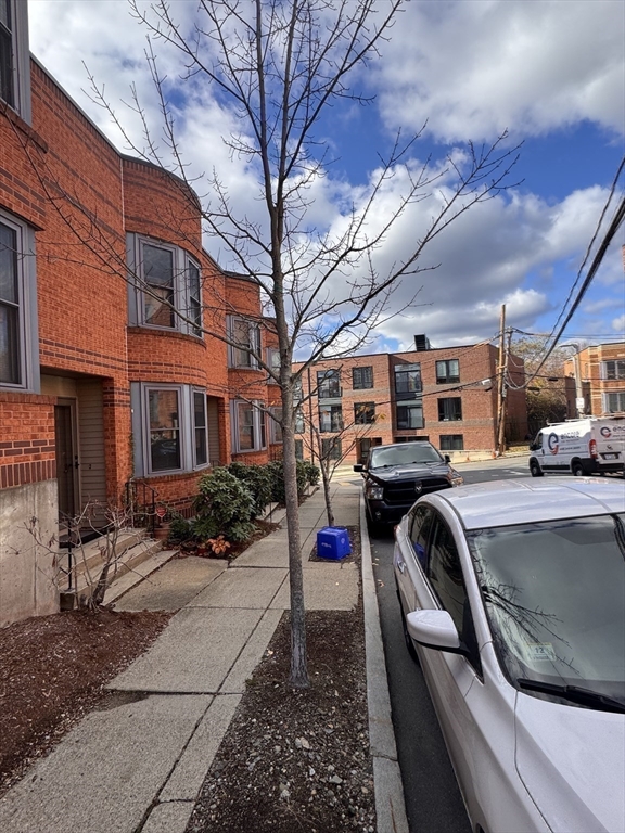 100 Lawn Street, Unit 100 Boston, MA 02120 - Photo 30 of 40 a view of a parked cars in front of a building