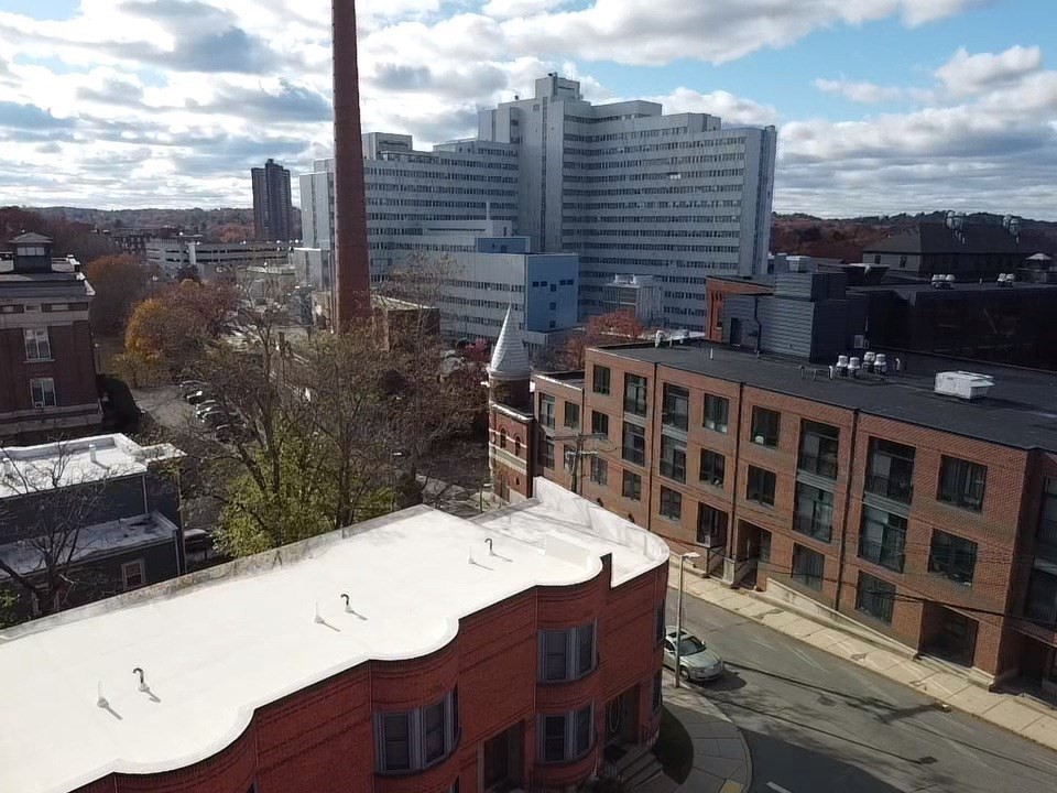 100 Lawn Street, Unit 100 Boston, MA 02120 - Photo 31 of 40 a view of a balcony with a table and chairs