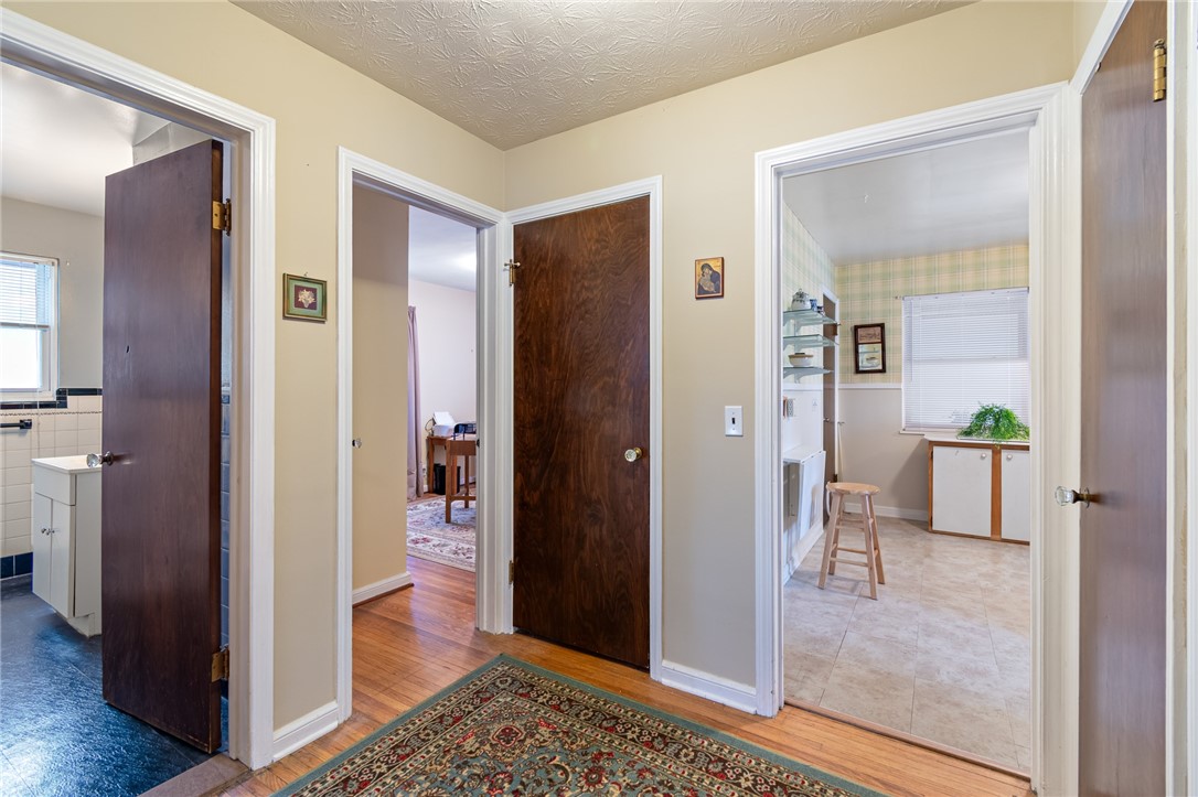 465 Laurelton Road Irondequoit, NY 14609 - Photo 24 of 43 The hall (with THREE FLOOR TO CEILING CLOSETS for