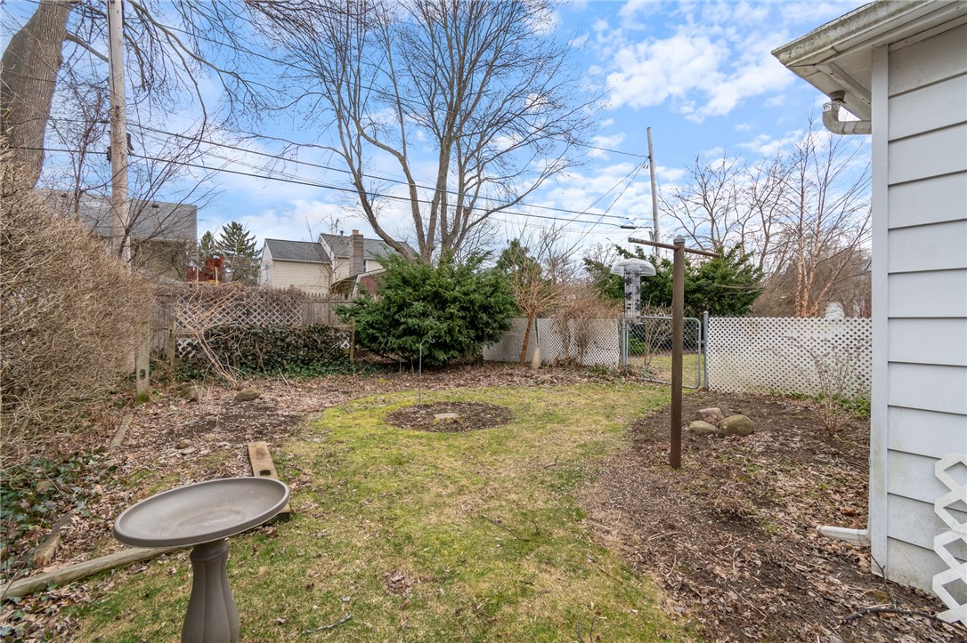 465 Laurelton Road Irondequoit, NY 14609 - Photo 3 of 43 The FULLY FENCED yard will really POP with the war