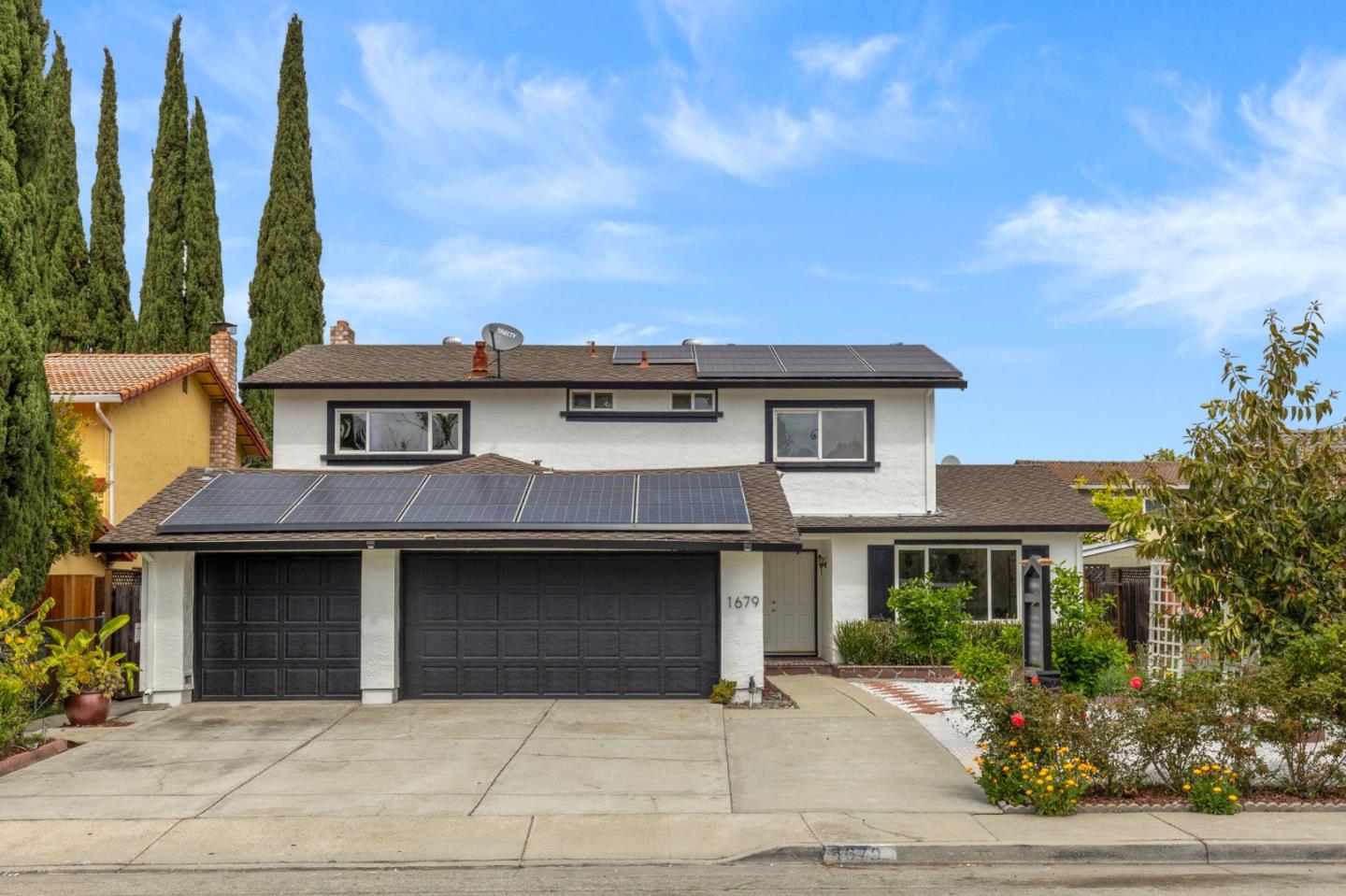 1679 Commodore Drive San Jose, CA 95133 - Photo 1 of 1 a front view of a house with a garden