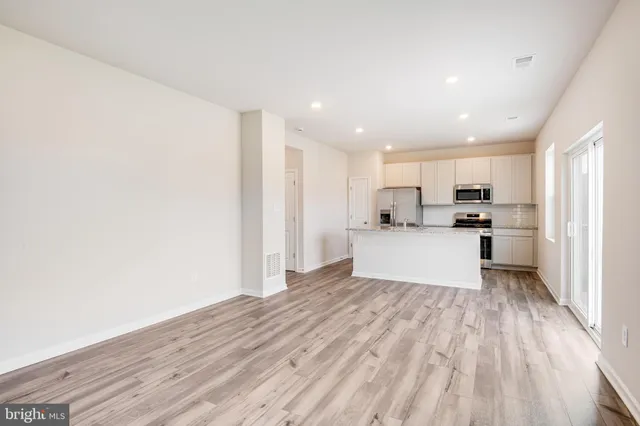 a view of kitchen with wooden floor