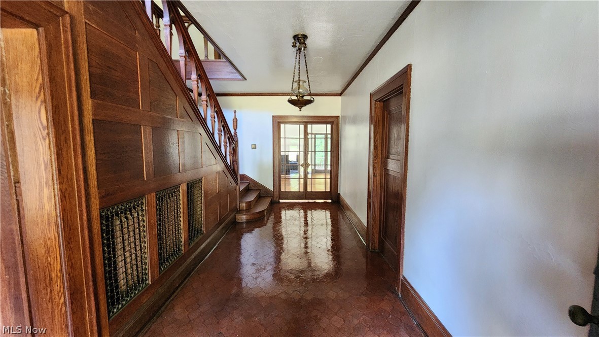 Foyer with french doors and crown molding