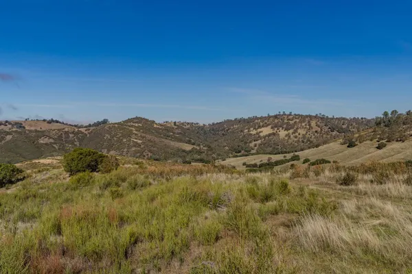 a view of a yard with mountain view