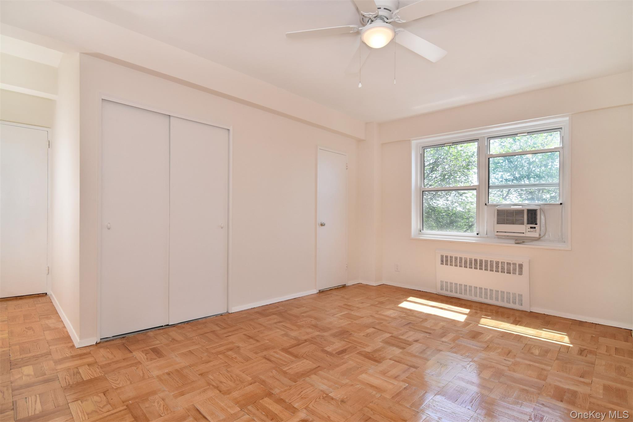 900 Palmer Road, Unit 7L Bronxville, NY 10708 - Photo 13 of 21 a view of an empty room with a window