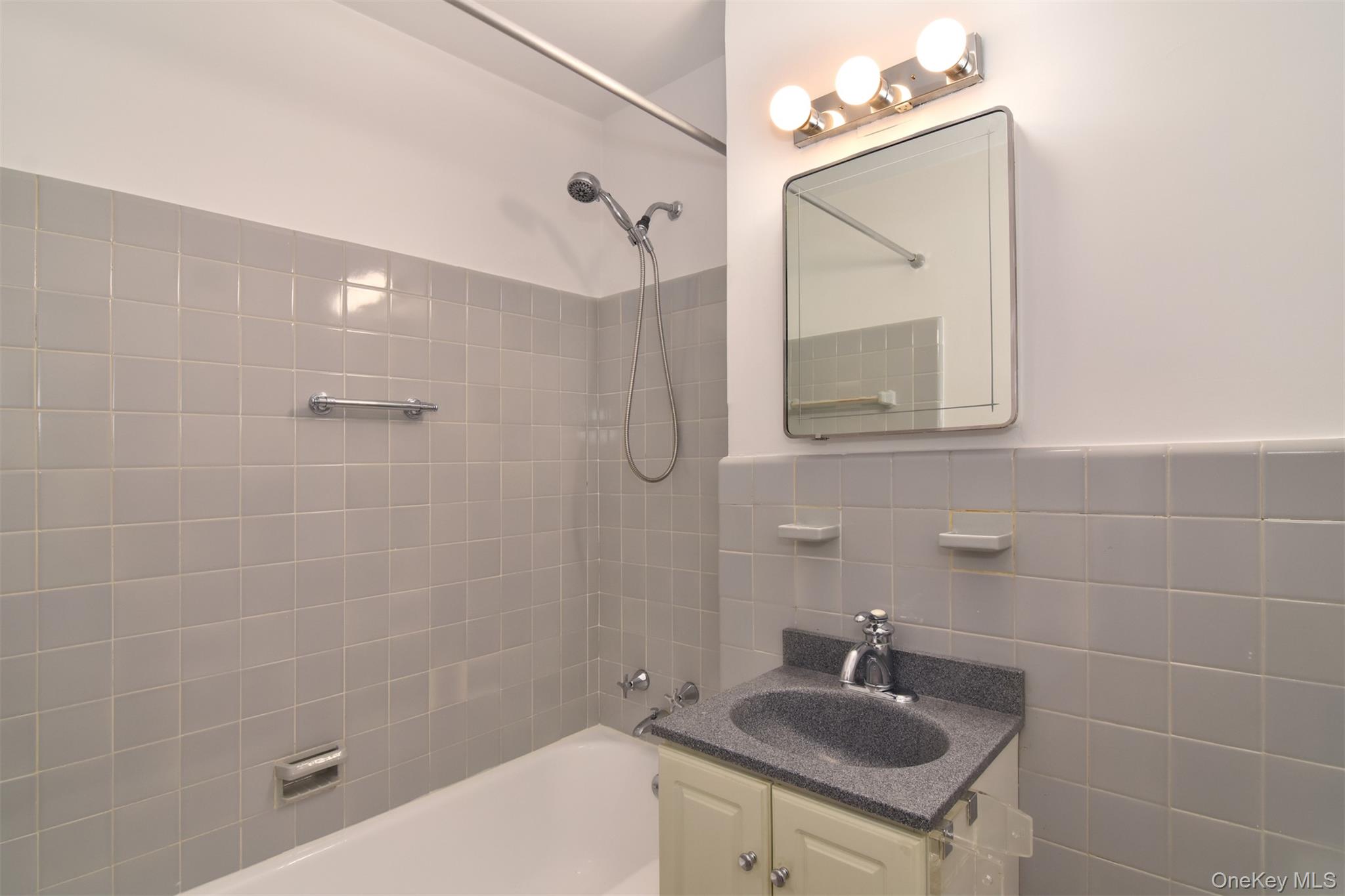 900 Palmer Road, Unit 7L Bronxville, NY 10708 - Photo 17 of 21 a bathroom with a sink mirror toilet and shower