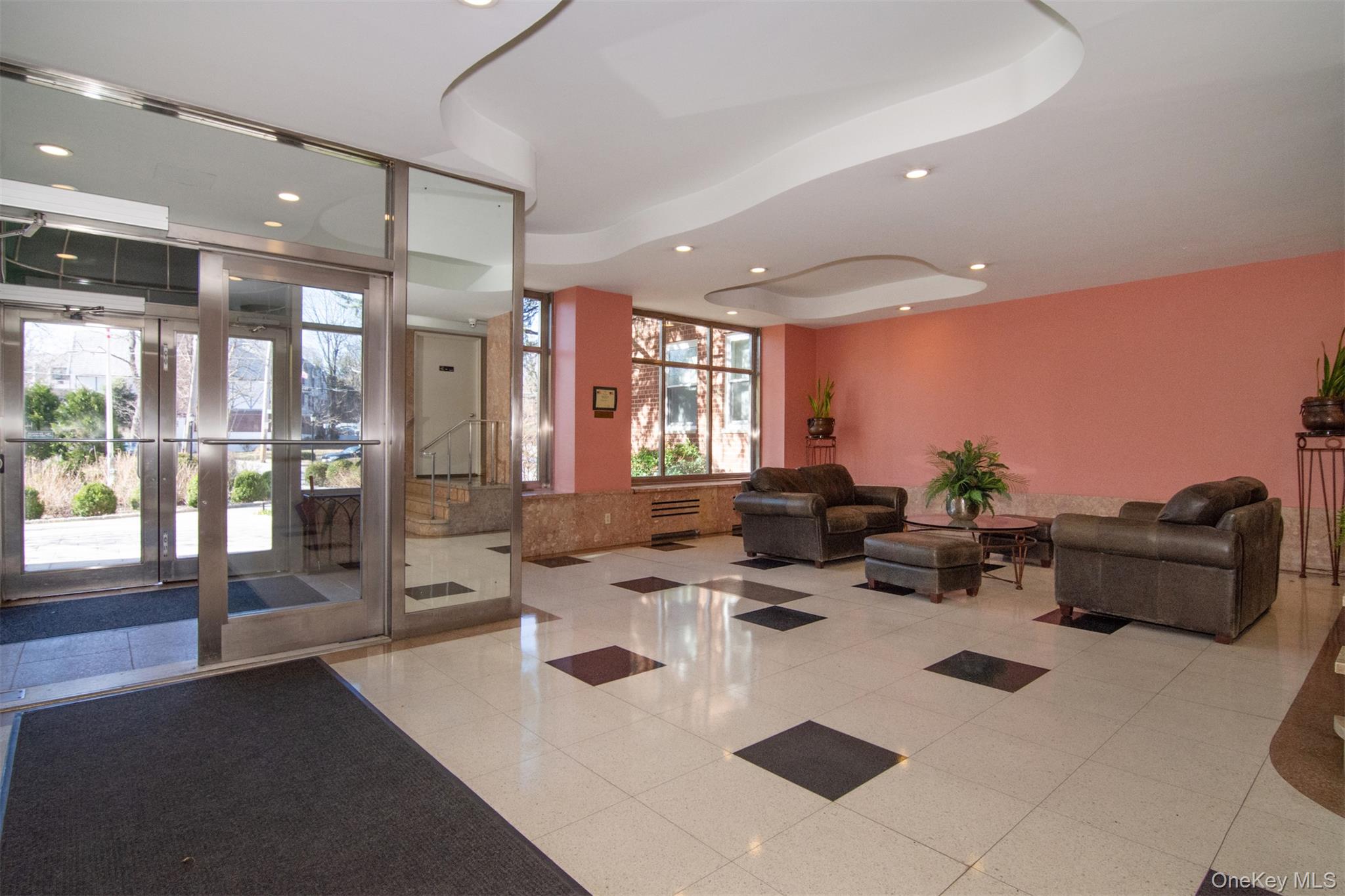 900 Palmer Road, Unit 7L Bronxville, NY 10708 - Photo 20 of 21 a living room with furniture and a large window