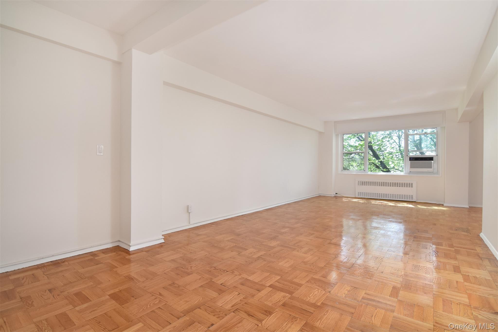 900 Palmer Road, Unit 7L Bronxville, NY 10708 - Photo 3 of 21 an empty room with windows