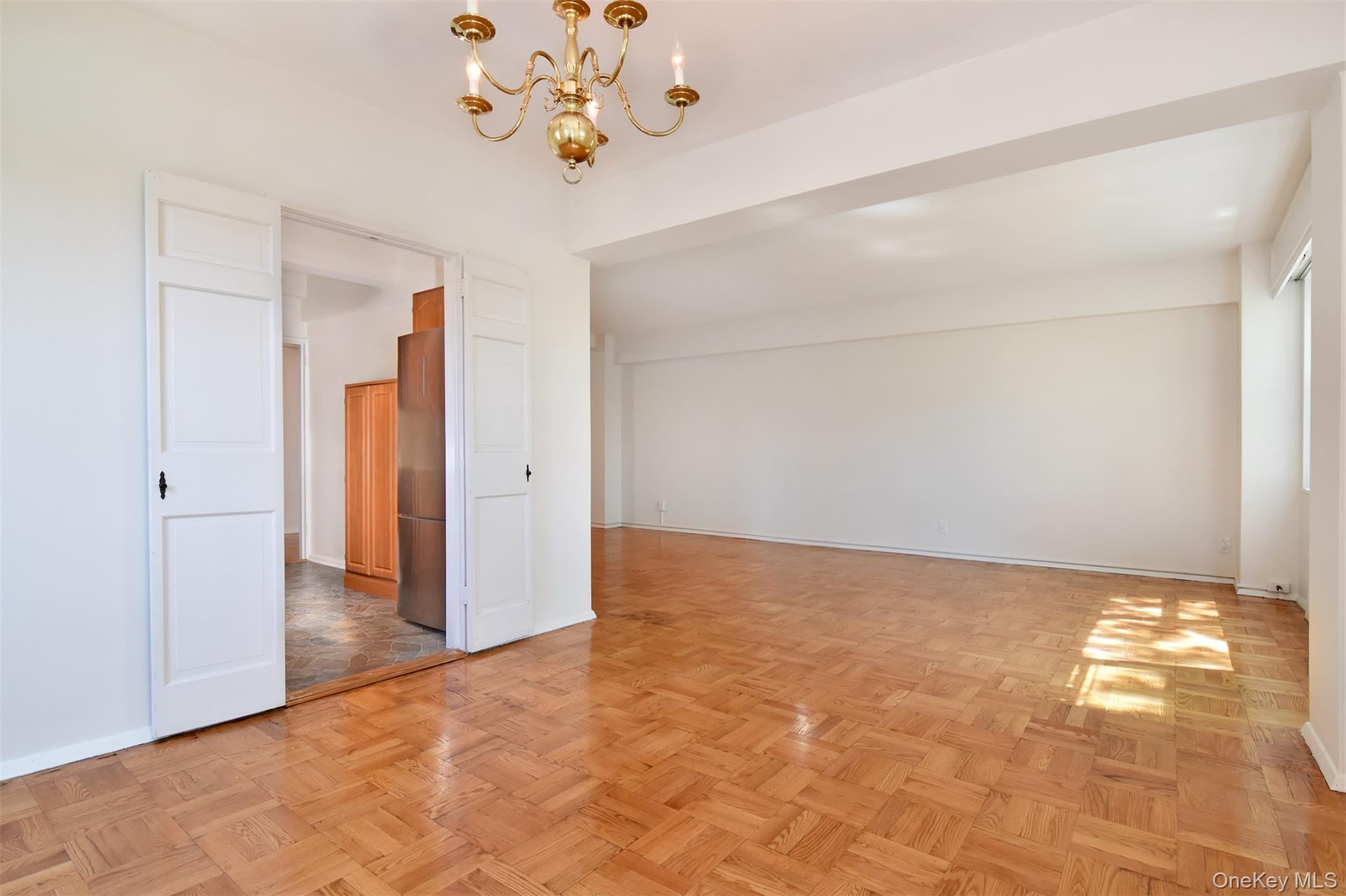 900 Palmer Road, Unit 7L Bronxville, NY 10708 - Photo 5 of 21 a view of an empty room with a window