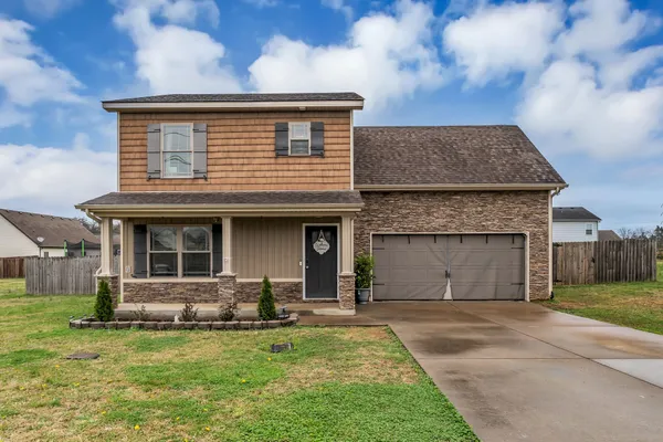 a front view of a house with a yard