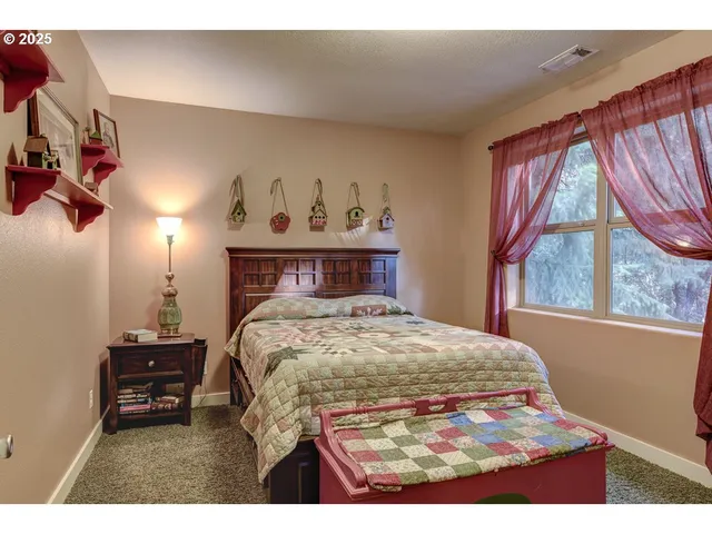 a bedroom with a bed and a mirror