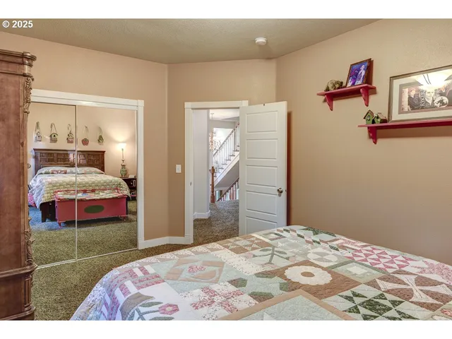 a bedroom with furniture and a window