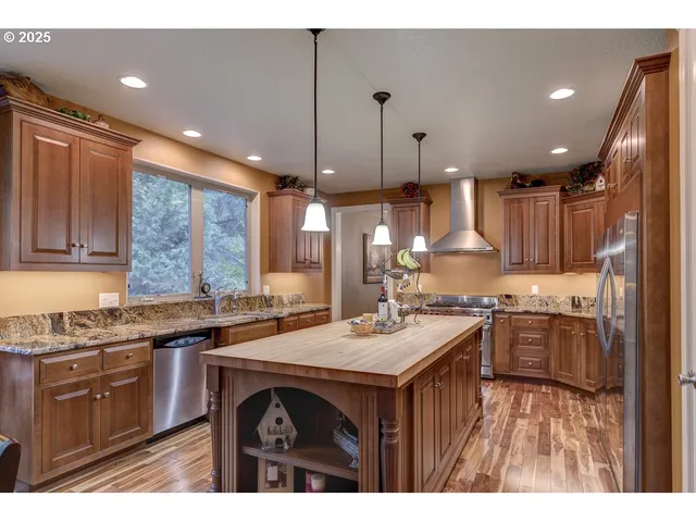 a kitchen with a table and chairs in it