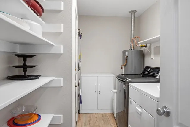 a kitchen with stainless steel appliances granite countertop a sink and a stove