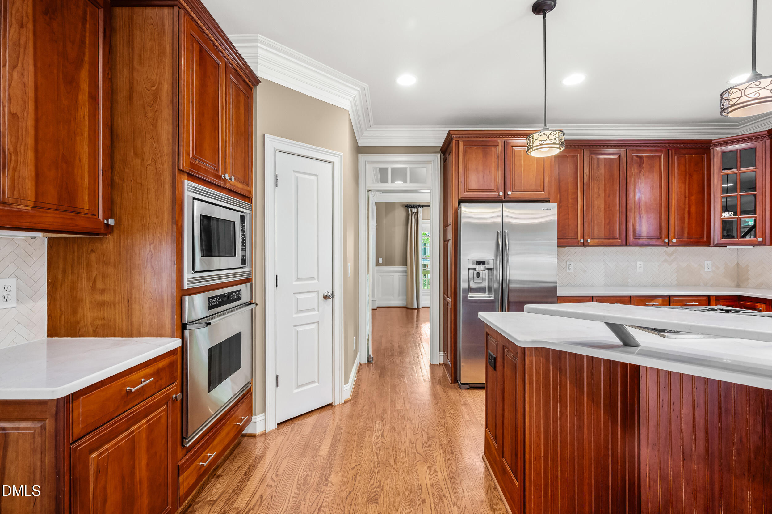 3821 Falls River Avenue Raleigh, NC 27614 - Photo 30 of 76 Kitchen with pantry door and Dacor appliances on left