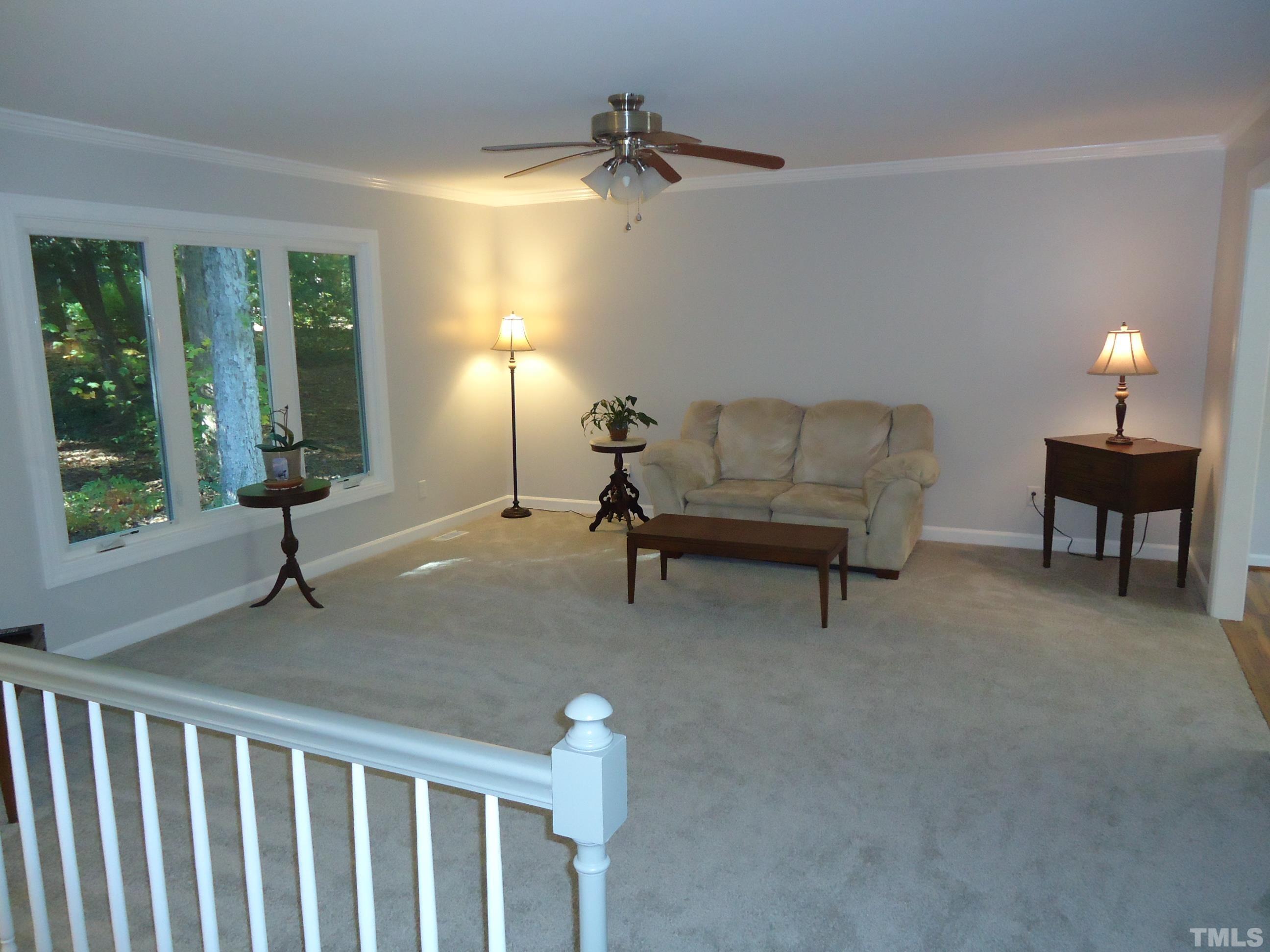 5405 Edington Lane Raleigh, NC 27604 - Photo 11 of 30 a living room with furniture and a lamp