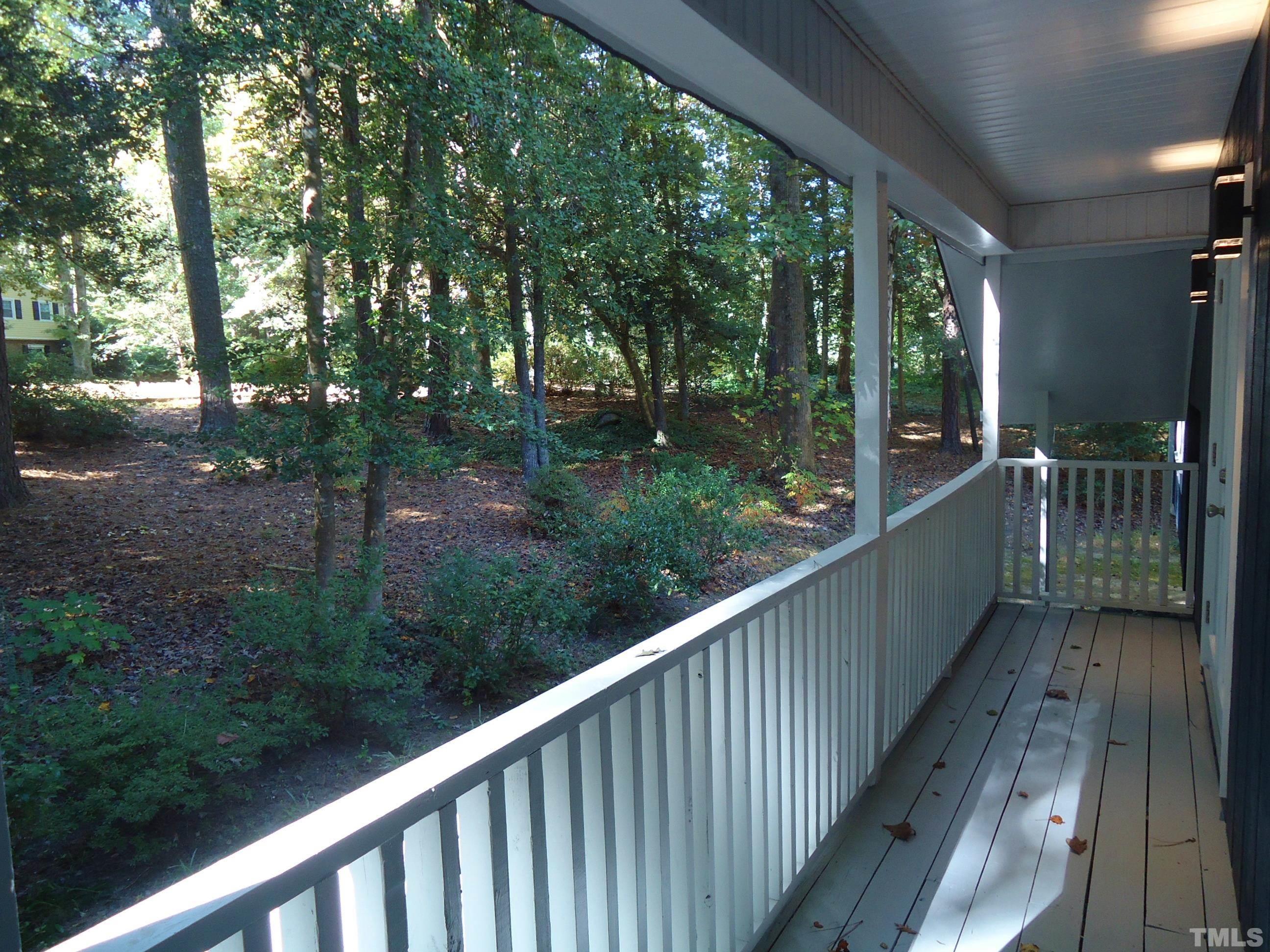 5405 Edington Lane Raleigh, NC 27604 - Photo 22 of 30 a view of a wooden deck next to a yard