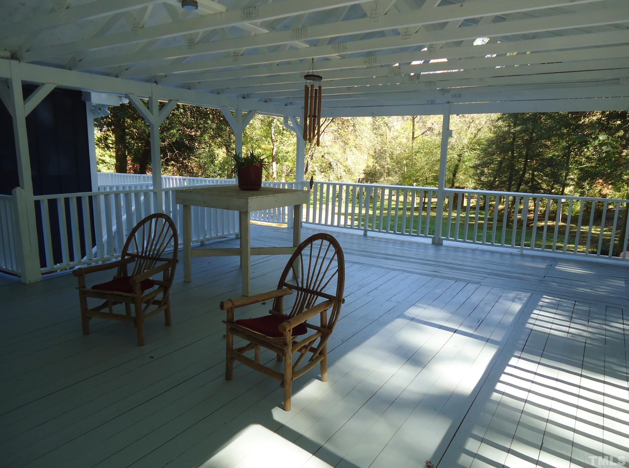5405 Edington Lane Raleigh, NC 27604 - Photo 4 of 30 a view of a chairs and table in patio with wooden fence