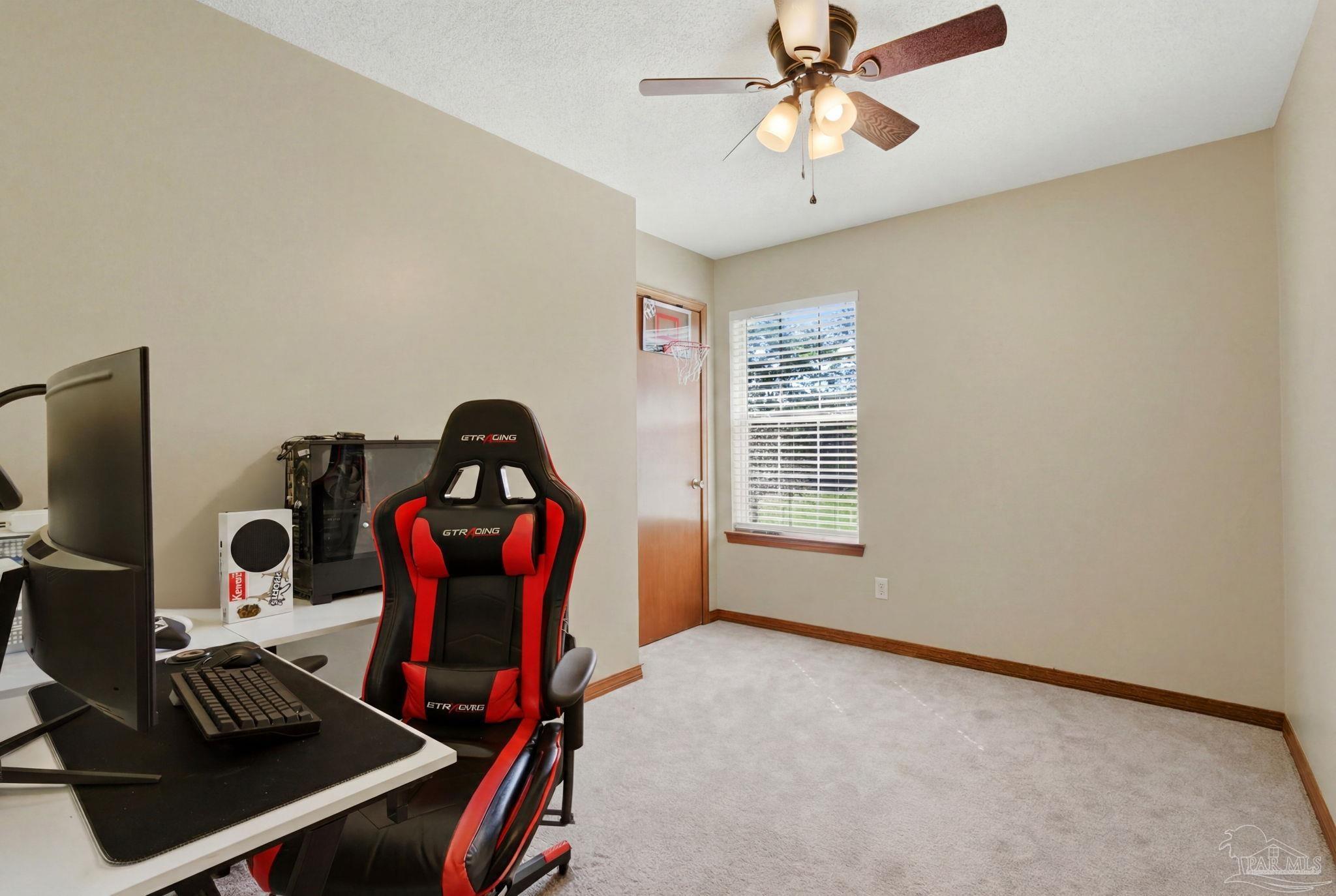 6870 Martin Road Milton, FL 32570 - Photo 24 of 48 a view of a workspace with furniture and a window