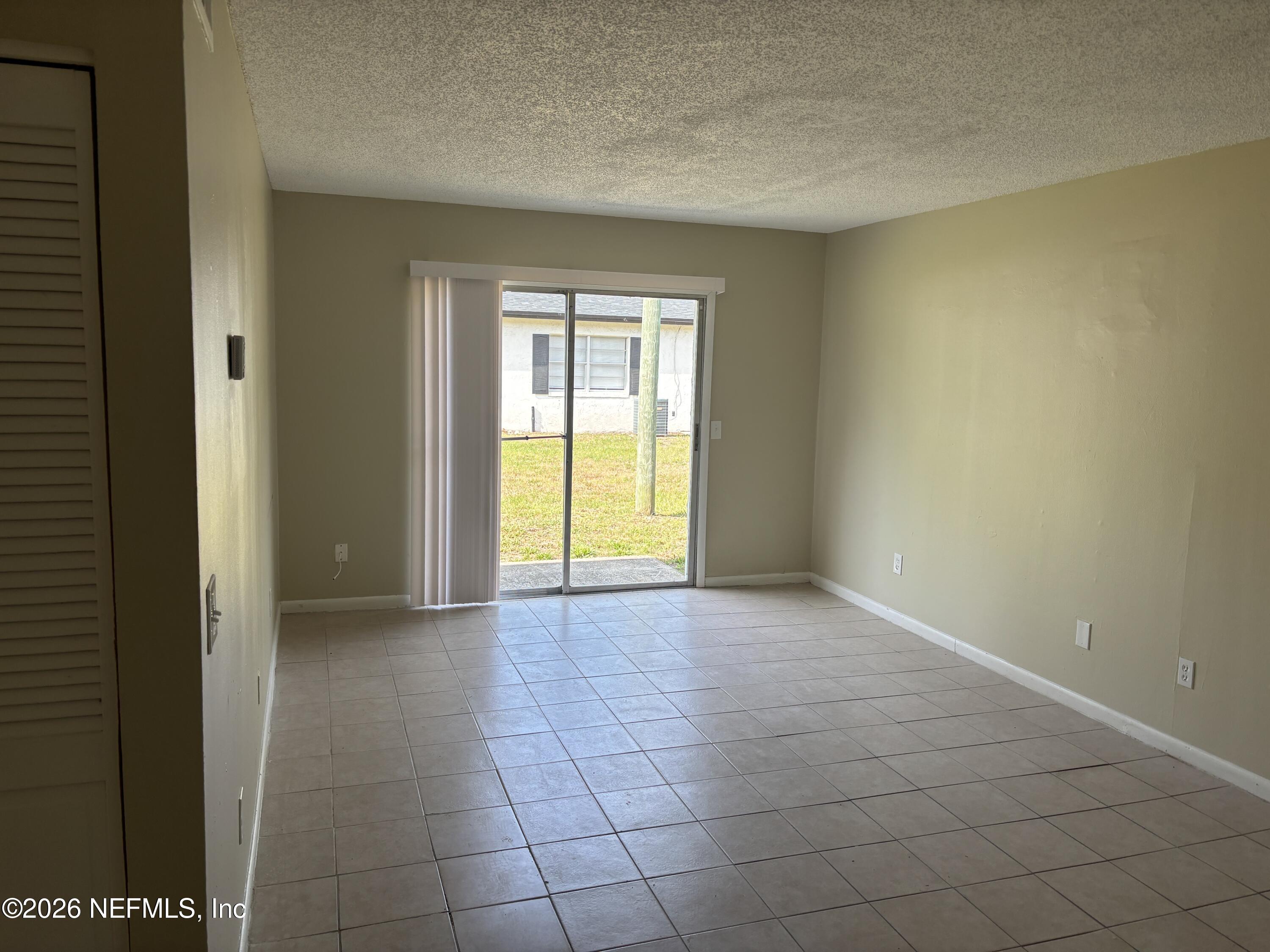 1515 Pullen Road, Unit 4 Jacksonville, FL 32216 - Photo 2 of 14 a view of an empty room with a window