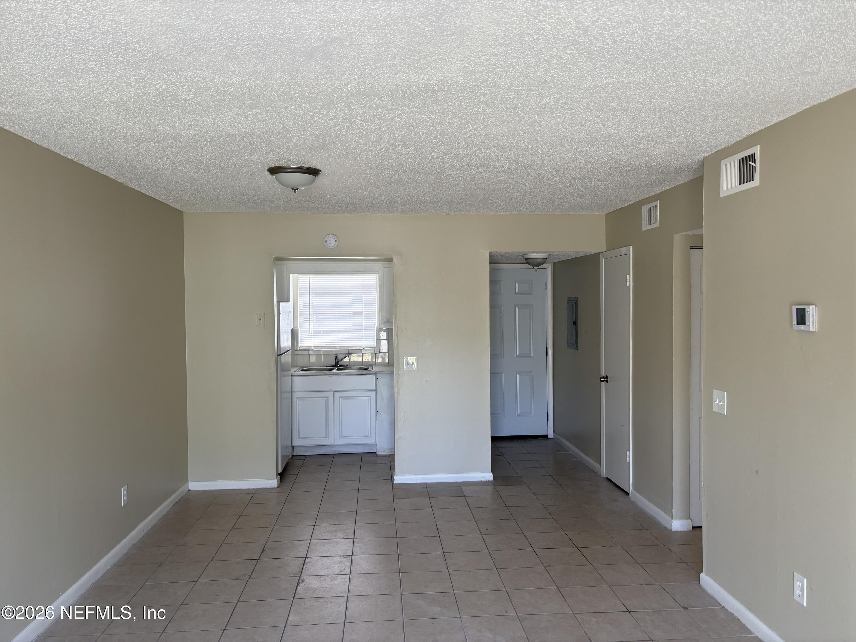 1515 Pullen Road, Unit 4 Jacksonville, FL 32216 - Photo 4 of 14 a view of a hallway with a kitchen