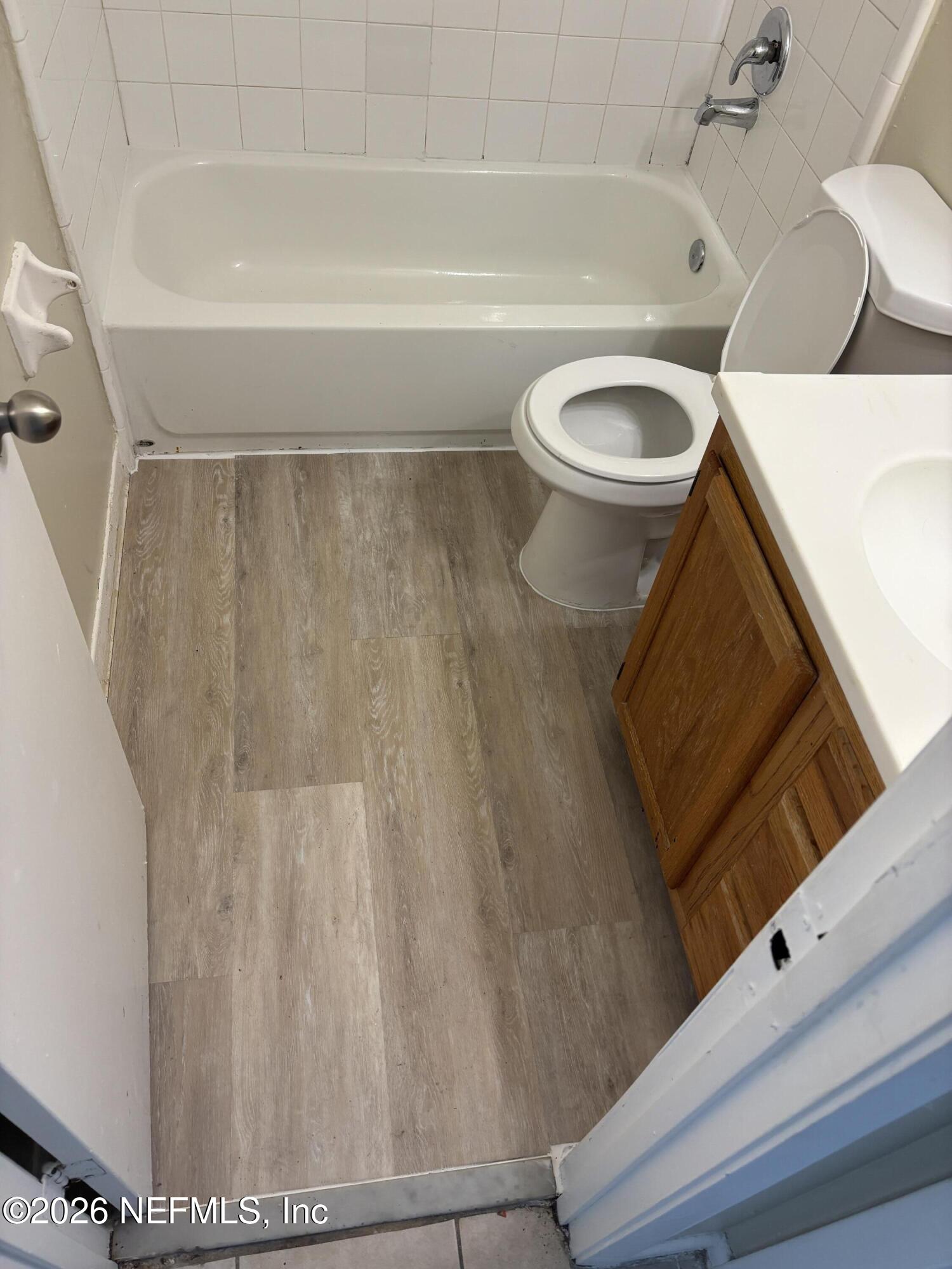 1515 Pullen Road, Unit 4 Jacksonville, FL 32216 - Photo 8 of 14 a bathroom with a sink a toilet and bathtub