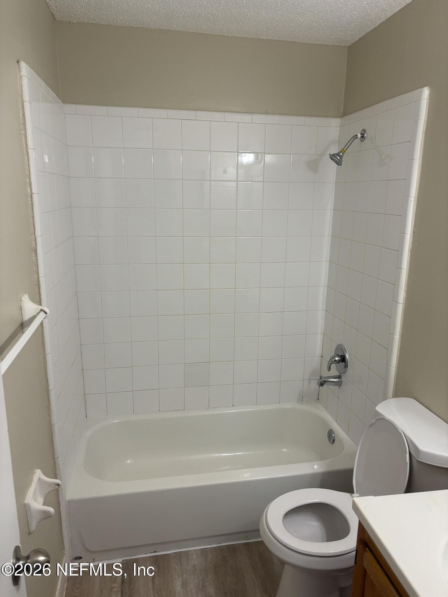 1515 Pullen Road, Unit 4 Jacksonville, FL 32216 - Photo 9 of 14 a bathroom with a toilet and a bathtub